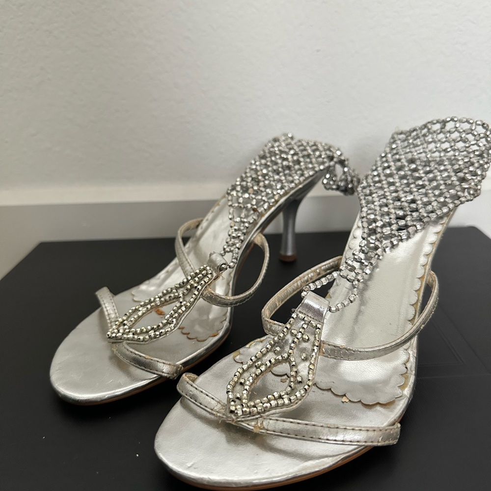 Silver mules with stoned ankle accessory